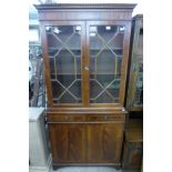 A George III style inlaid mahogany bookcase