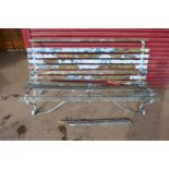 A wrought iron garden bench