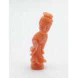 A small carved coral figure of an oriental lady, 37mm