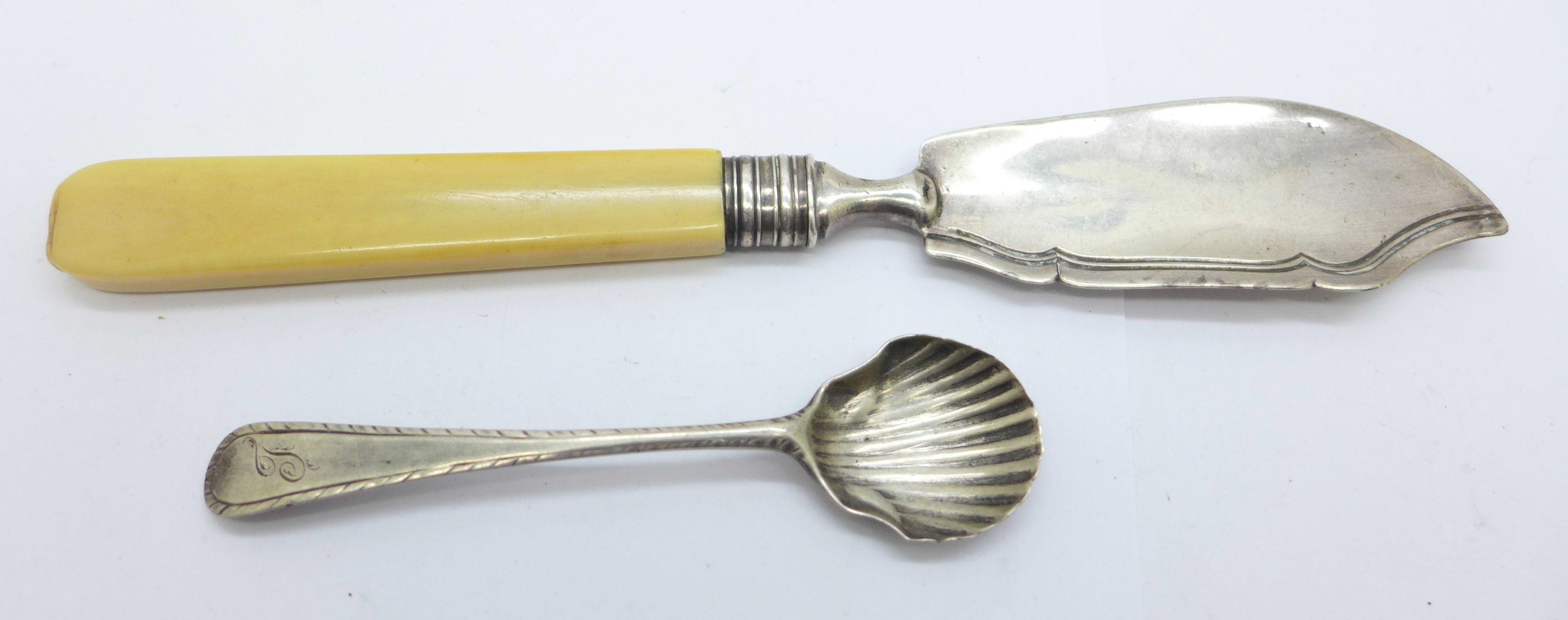 A Victorian silver butter spade by George Unite, Birmingham 1860, a/f, and a bottom marked silver