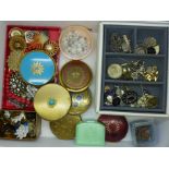 A collection of costume jewellery, clip-on earrings, compacts and a jewellery box with vintage