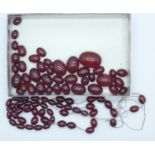 A collection of sherry amber coloured beads for re-stringing