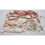 A collection of jewellery including mother of pearl and coral coloured