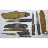 A collection of six knives, two lacking scabbards, a/f