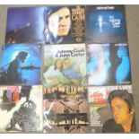 A collection of LP records, Glen Campbell, Johnny Cash, Don Williams and John Denver