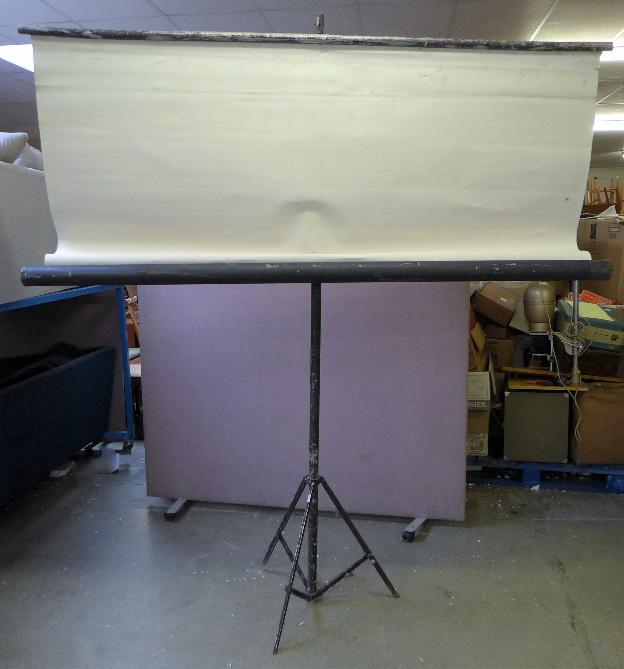 A large free-standing projector screen measuring 270cm H x 240 W (height including stand)