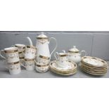 An Olde England Elizabethan pattern china tea and coffee service, comprising two tea cups, eight