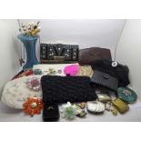 A collection of lady's purses, evening bags, hat pins, hat pin stand, compacts, etc.