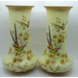 A pair of Crown Ducal Edwardian blush ivory vases, decorated with birds and butterflies, one a/f (