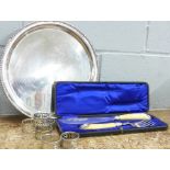 A silver plated salver, fish servers and a set of six napkins