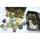 A collection of badges, pin badges and coins