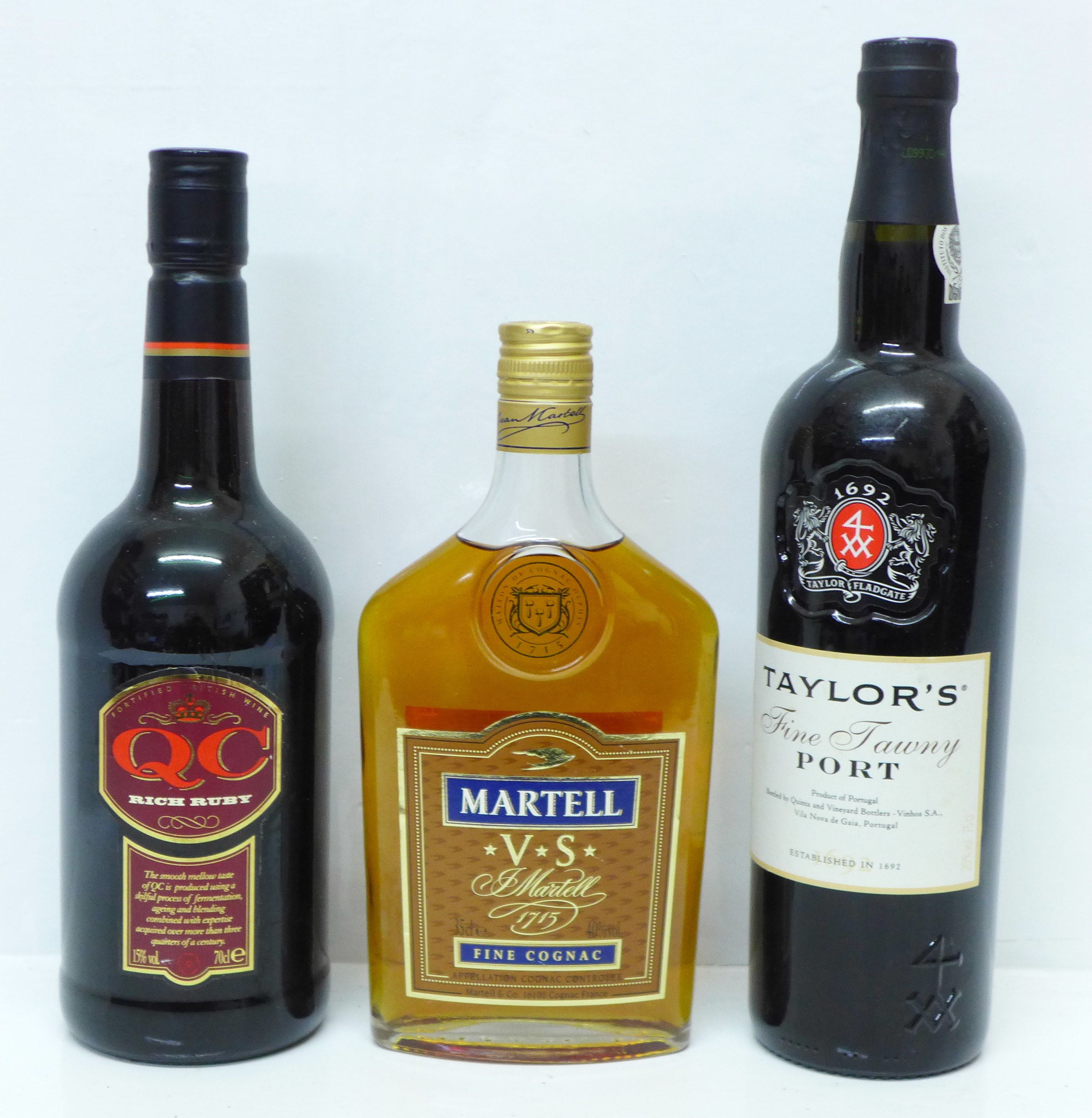 Two bottles of port, Taylor's Fine Tawny and QC Rich Ruby and a 35cl bottle of Martell V.S. Fine