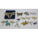 Fifteen costume brooches; eleven dragonflies, snake signed A&S, dog, bird and butterfly