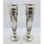 A pair of pierced and engraved silver vases, Birmingham 1903, weighted, 15.5cm