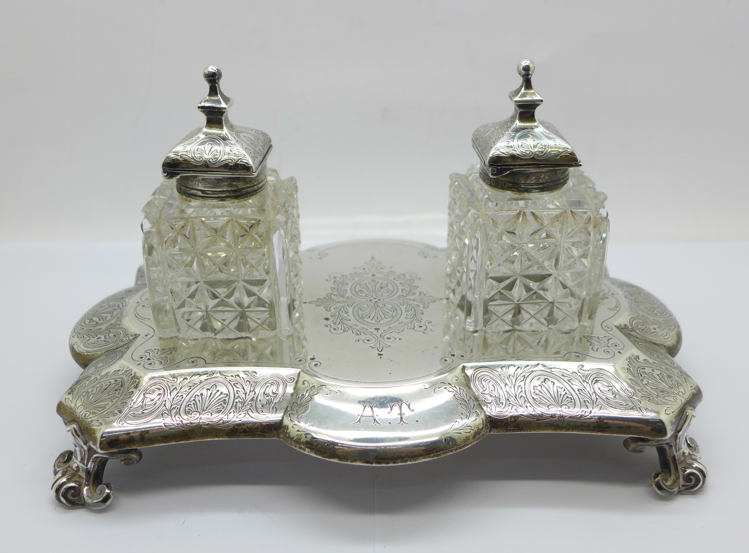 A Victorian silver inkstand with two inkwells, London 1883, Walter & John Barnard, width of base