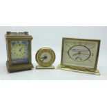 Three clocks; a small carriage clock with decorative panels, a Smiths clock and a T.A. Woods