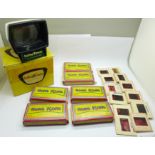 A Halina slide viewer and a collection of coloured slides of Hong Kong scenes