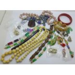 Costume jewellery including necklaces, bracelets and bangles and a novelty letter opener