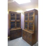 A pair of carved oak bookcases