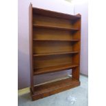A stained pine open bookcase
