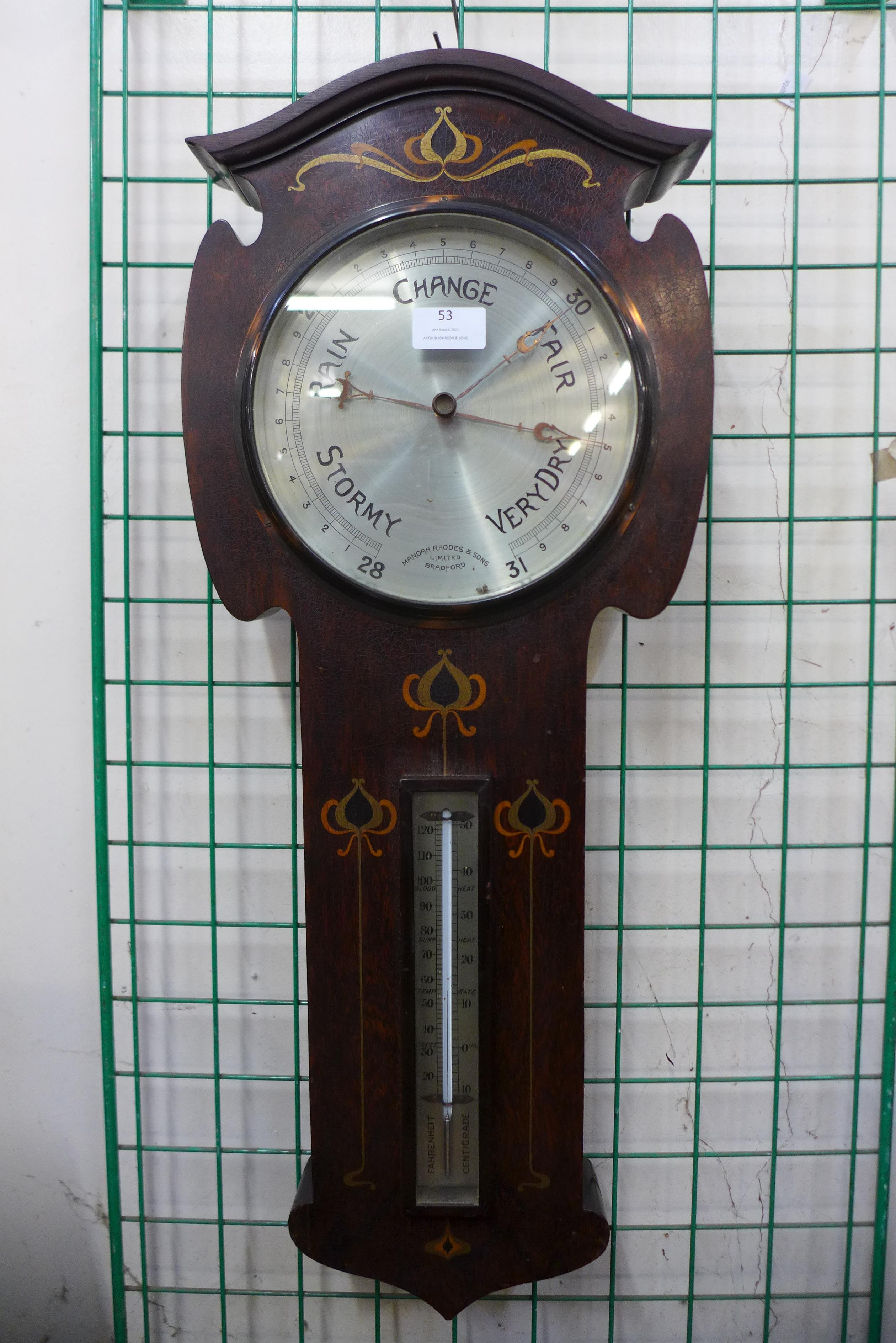 An Arts and Crafts inlaid rosewood aneroid barometer