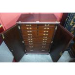 A mahogany fitted fourteen drawer collector's cabinet, 92cms h, 62cms w, 36cms d