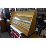 An oak table top display cabinet