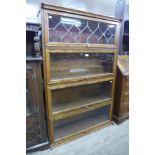 An oak four tier stacking sectional bookcase