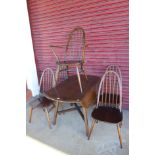 An Ercol dark elm and beech drop-leaf table and five chairs