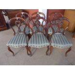 A set of six Victorian rosewood balloon back dining chairs