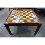 A Danish tiled top teak coffee table