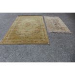 Two beige ground rugs