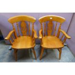 A pair of beech farmhouse armchairs
