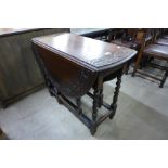 A carved oak barleytwist gateleg table