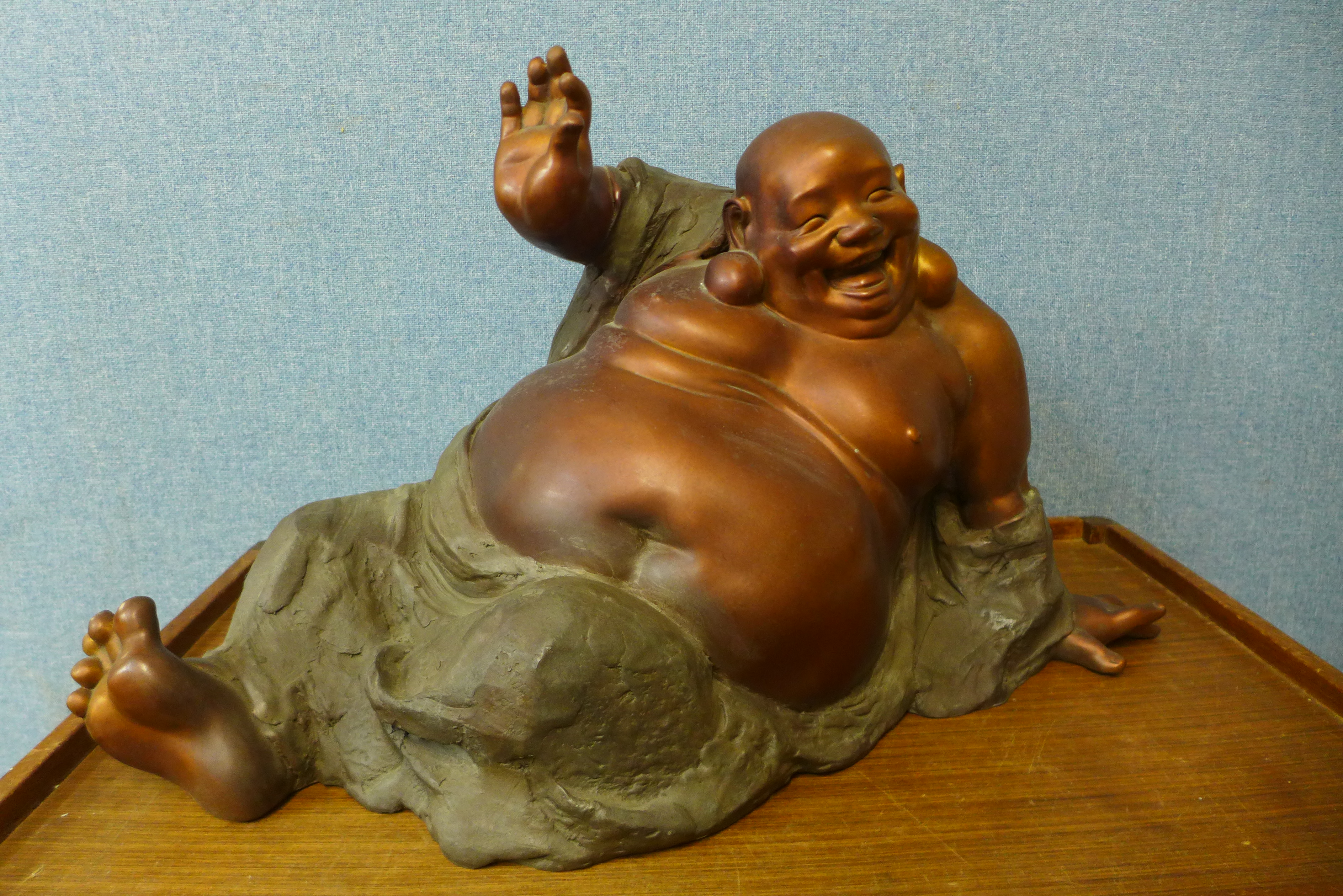 An oriental bronze figure of a seated Buddha, 36cms h