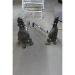 A pair of French Art Nouveau cast iron andirons