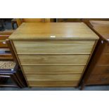 A teak chest of drawers