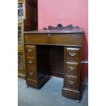 A Victorian mahogany kneehole desk, 89cms h, 69cms w, 39cms d