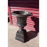 A Victorian cast iron campana shaped garden urn on stand, 69cms h x 39cms d