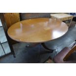 A Regency style inlaid mahogany oval breakfast table