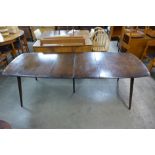 An Ercol dark elm and beech Grand Windsor extending dining table