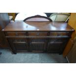 An Old Charm carved oak sideboard
