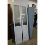 A pair of painted pine and etched glass interior doors