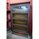 An early 20th Century oak four tier sectional stacking bookcase, 156cms h, 87cms w, 34cms d