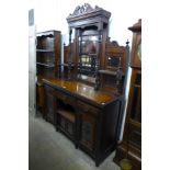 A Victorian carved walnut mirrorback sideboard, 219cms h, 151cms w, 50cms d