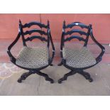 A pair of Italian ebonised x-frame Savaranola chairs