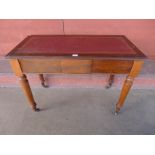 A Victorian mahogany and red leather topped two drawer writing table, 75cms h, 106cms w, 52cms d