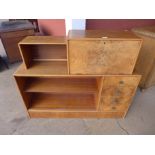 An Art Deco walnut open bookcase, 101cms h, 120cms w, 30cms d