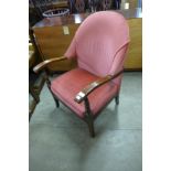 A 1930's upholstered beech fireside chair