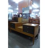 A Uniflex teak and afrosmosia dressing table